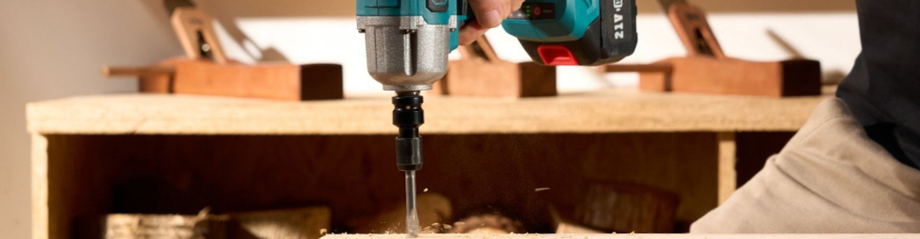 Close-up of a Seesii QH150 Impact Driver driving a drill bit into a wood block.