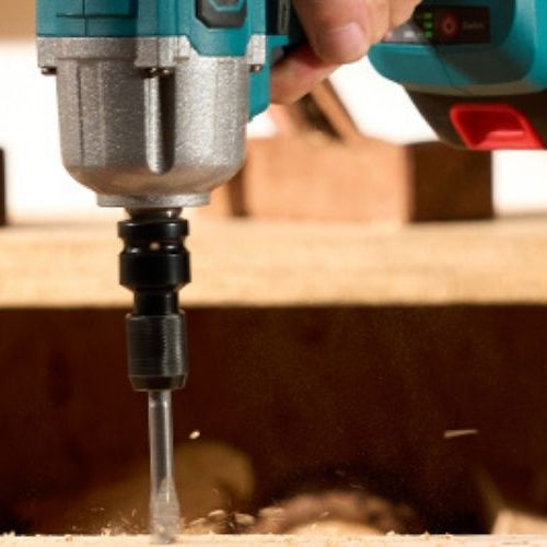Close-up of a Seesii QH150 Impact Driver driving a drill bit into a wood block.