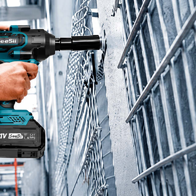 Cordless impact wrench fastening metal panels in an industrial workshop.