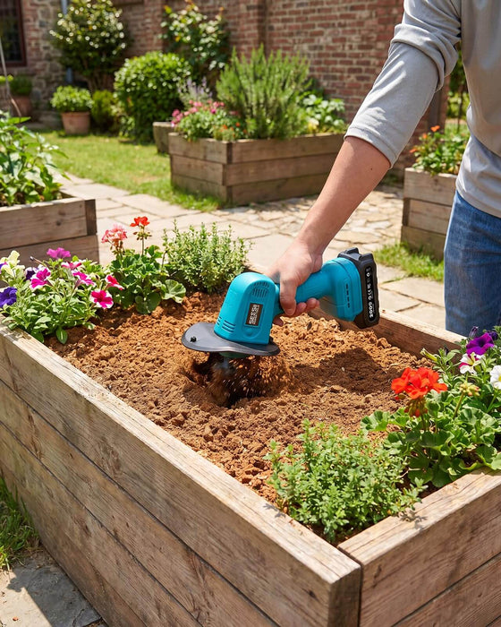 Seesii 20V teal mini cordless tiller cultivating soil in wooden raised flower bed with colorful flowers, lightweight handheld garden rototiller